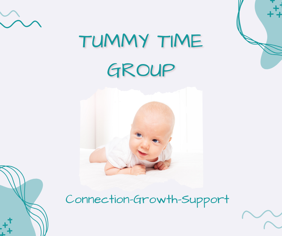 Tummy Time Group. Infant baby laying on stomach with head up and smiling